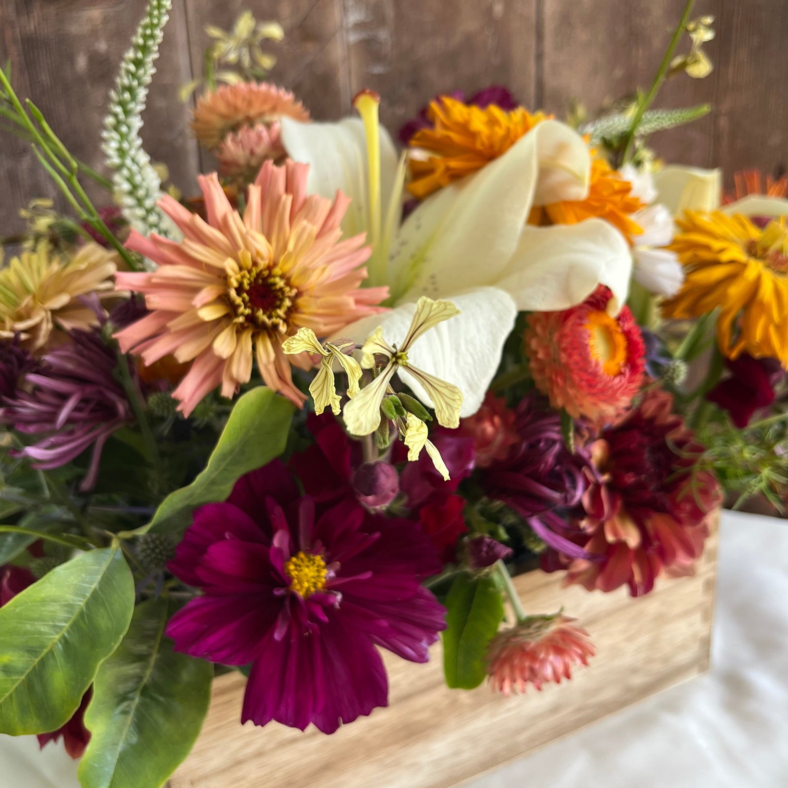 Colorful bouquet of flowers on a wooden surface wedding centerpiece